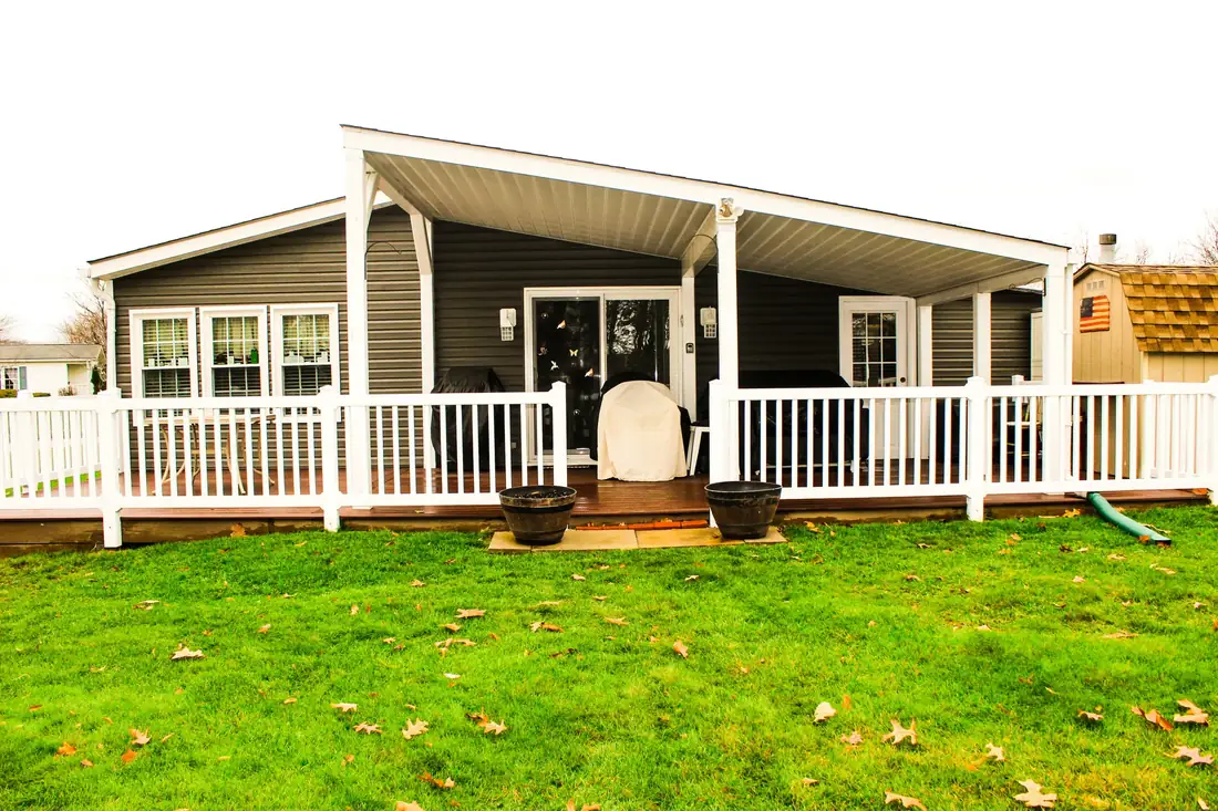 Covered porch with white vinyl rail — Oasis Custom Decks