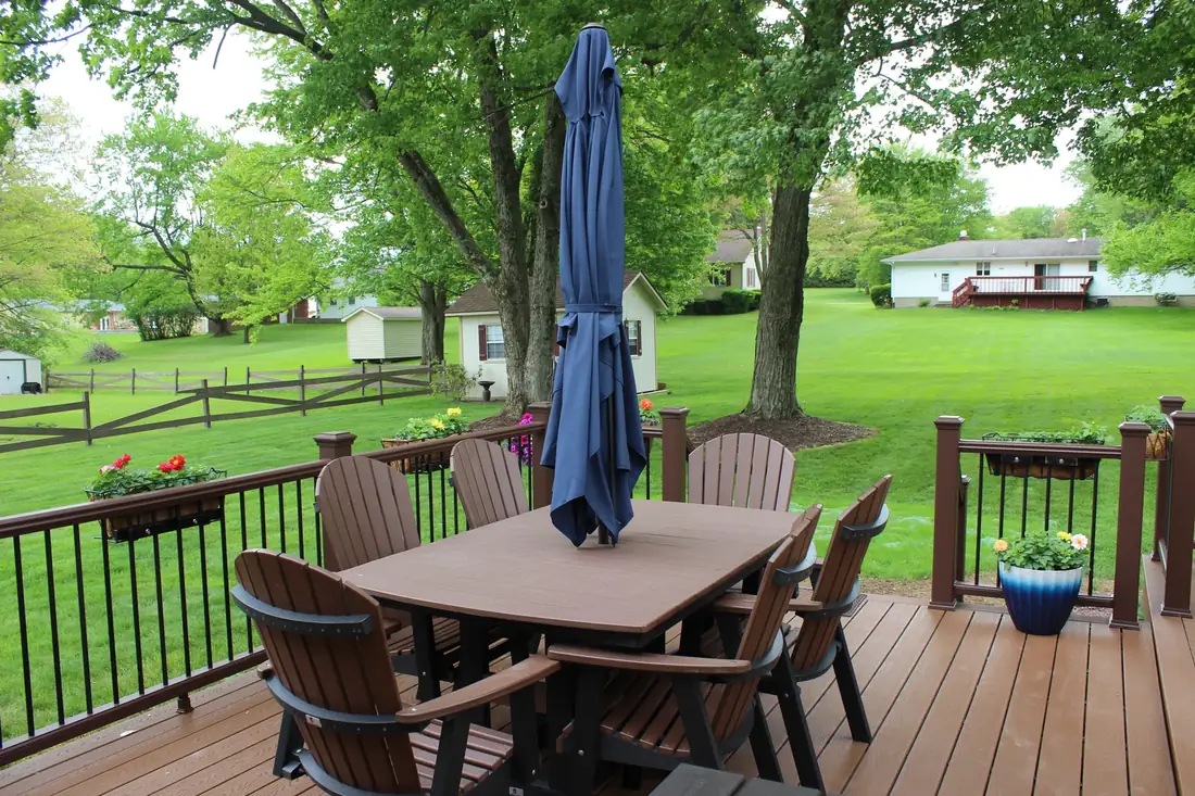 Deck dining under the trees — Oasis Custom Decks
