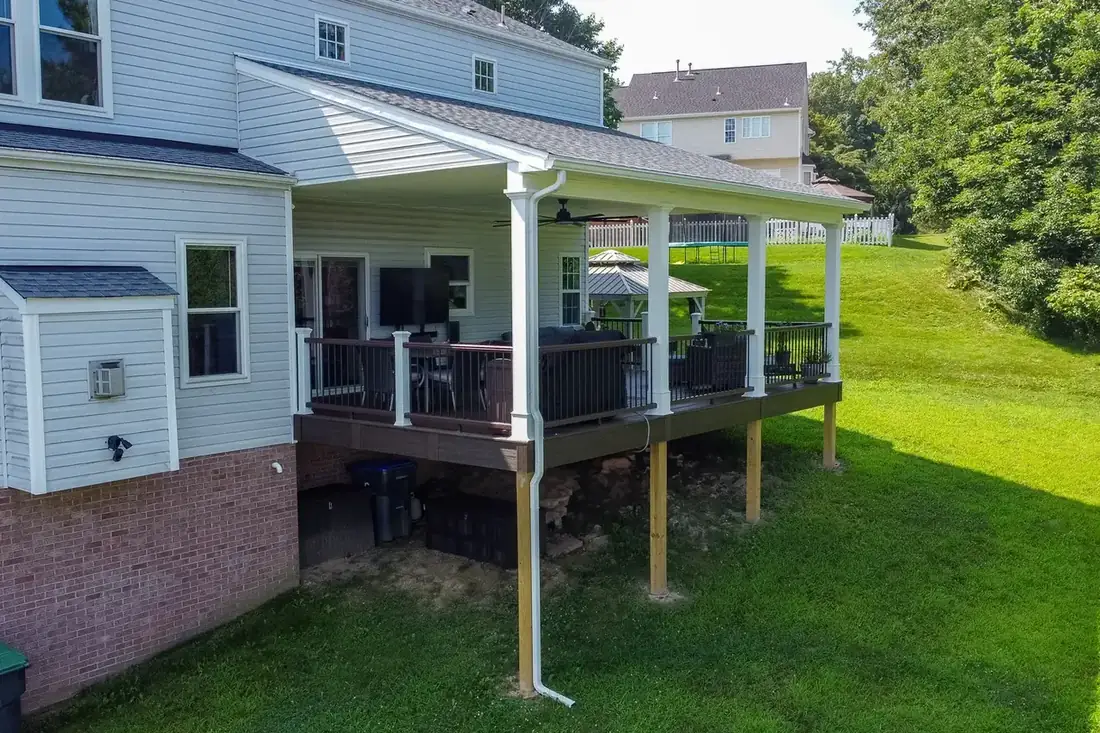 Covered deck with wrapped posts and ceiling fan — Oasis Custom Decks