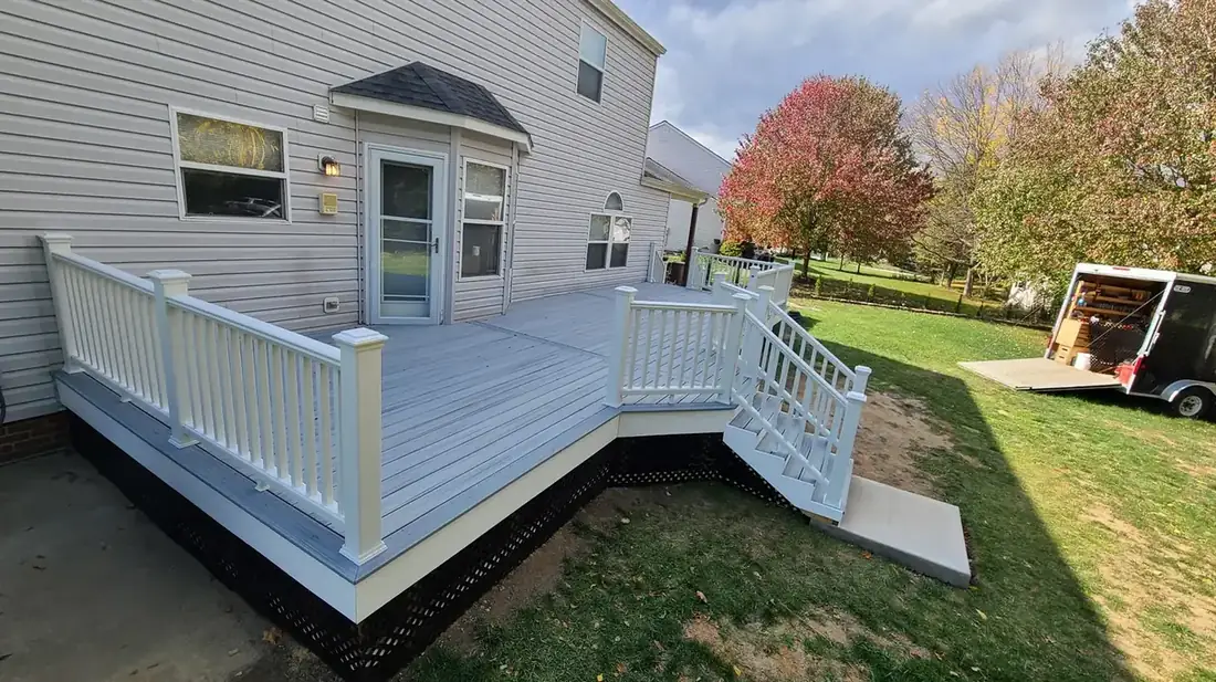 Gray composite deck with white rail — Oasis Custom Decks