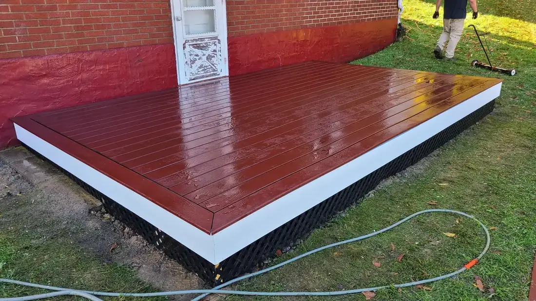 Ground-level deck, painted finish — Oasis Custom Decks