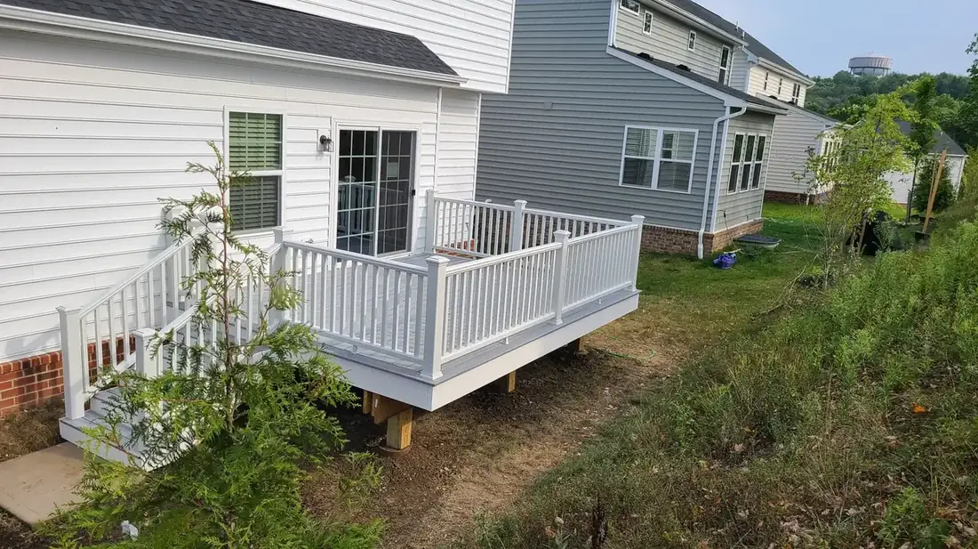 Composite deck with white vinyl rail — Oasis Custom Decks